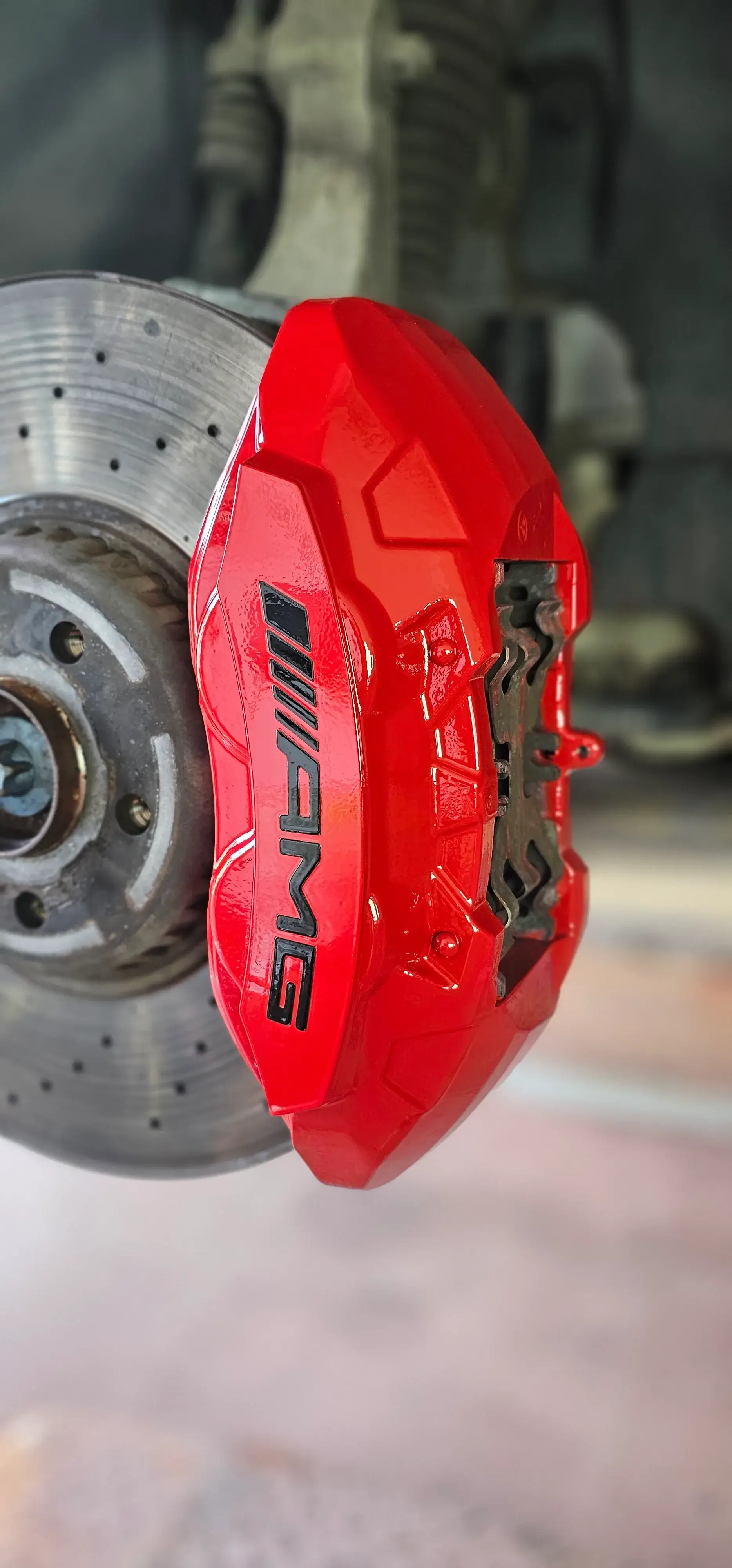 A close up of a brake on a vehicle.