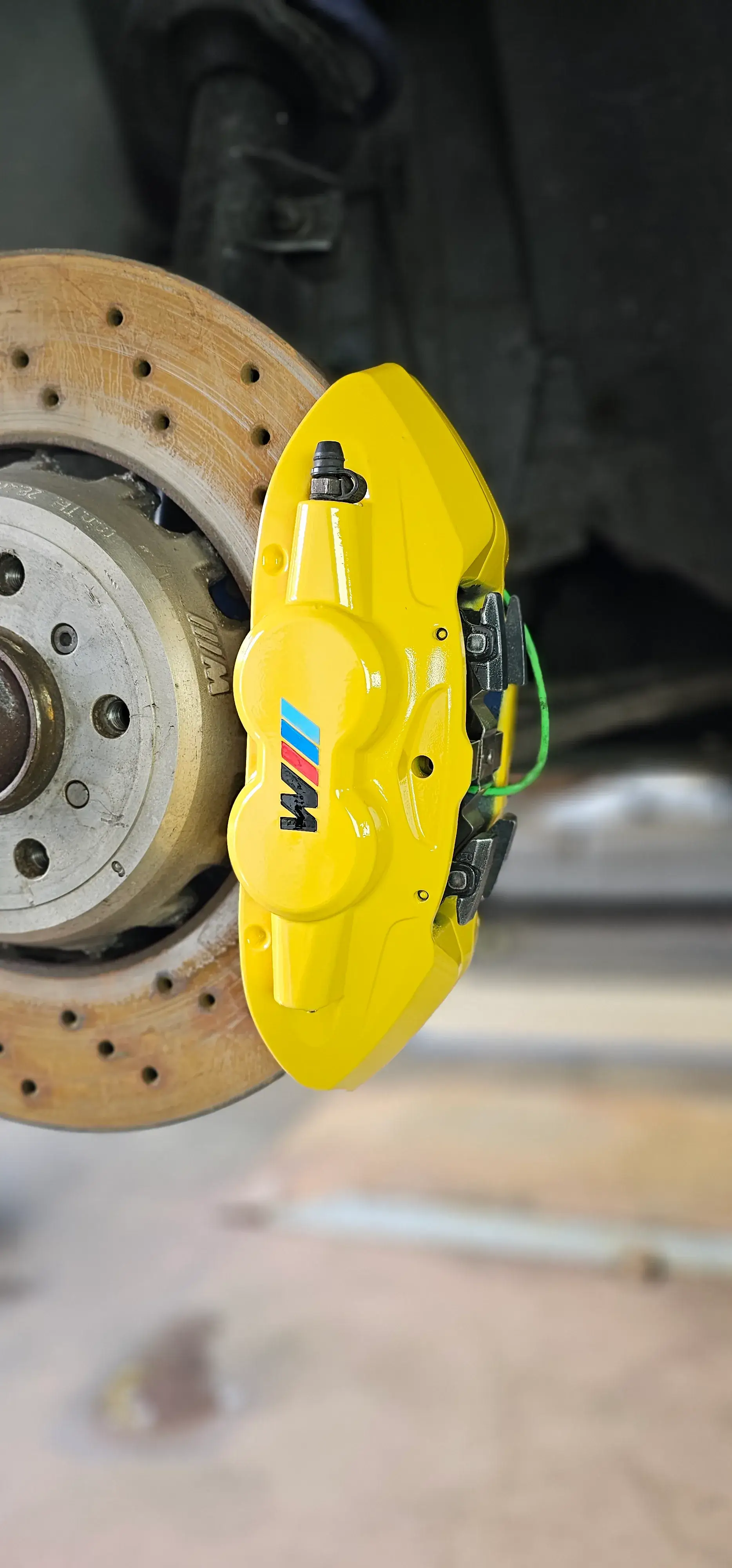 A close up of a brake on a vehicle.