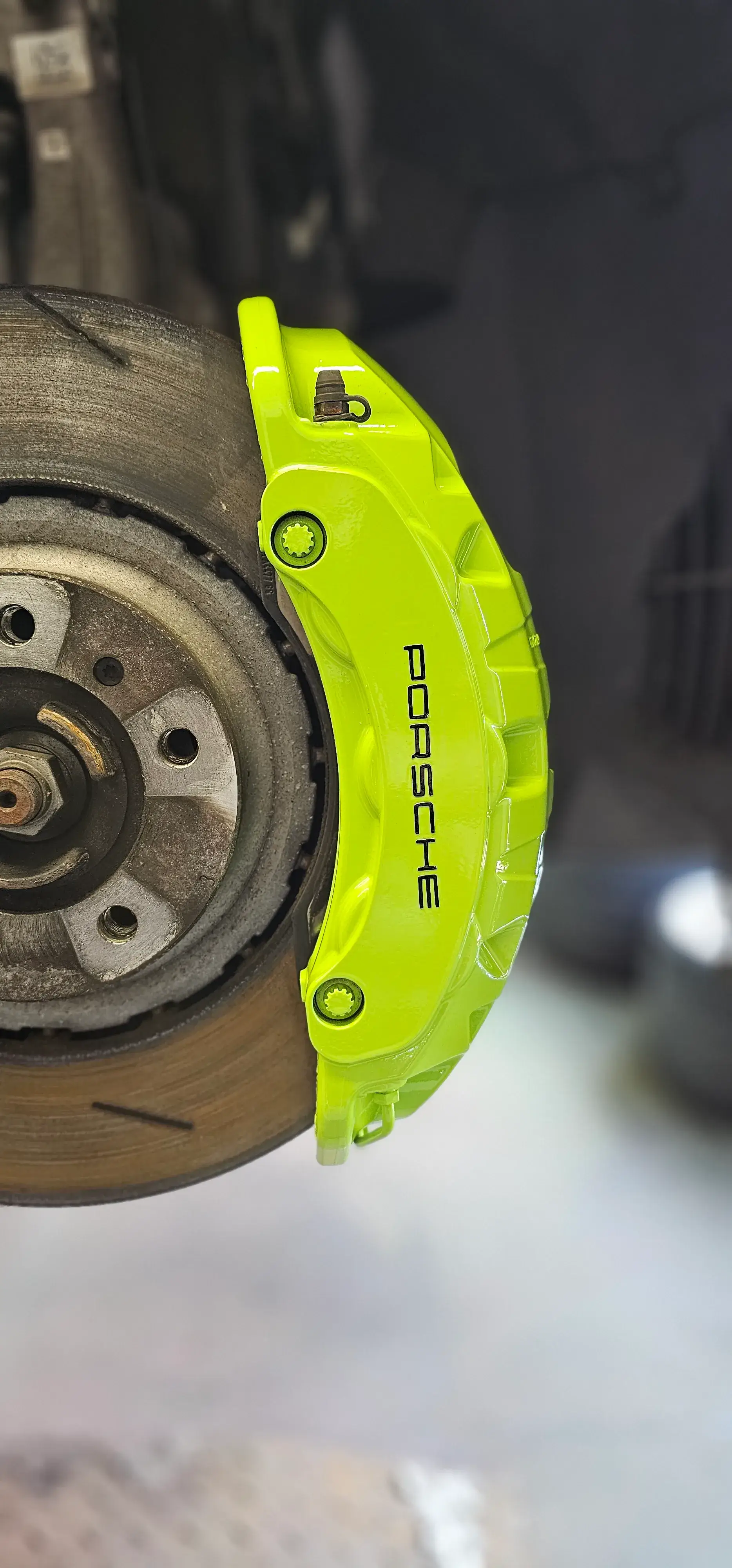 A close up of a brake on a vehicle.