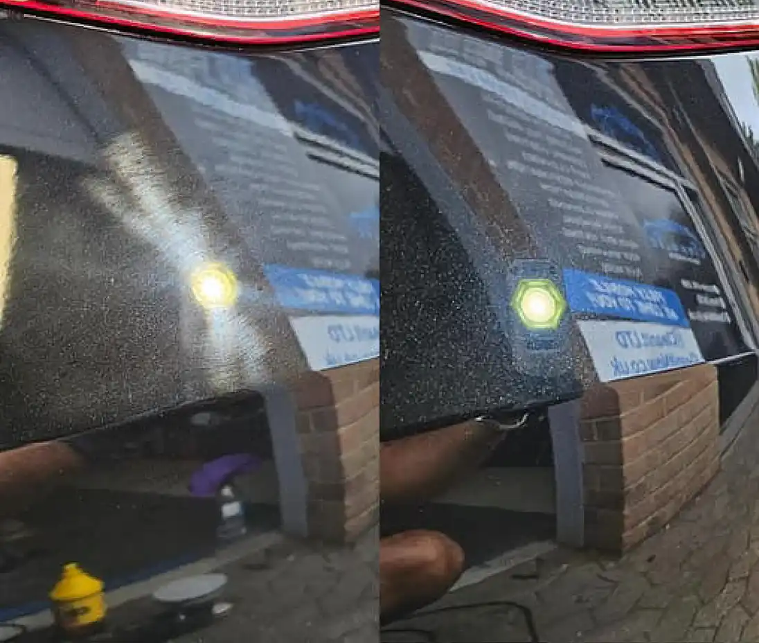 a reflection of a bus on the side of the road
