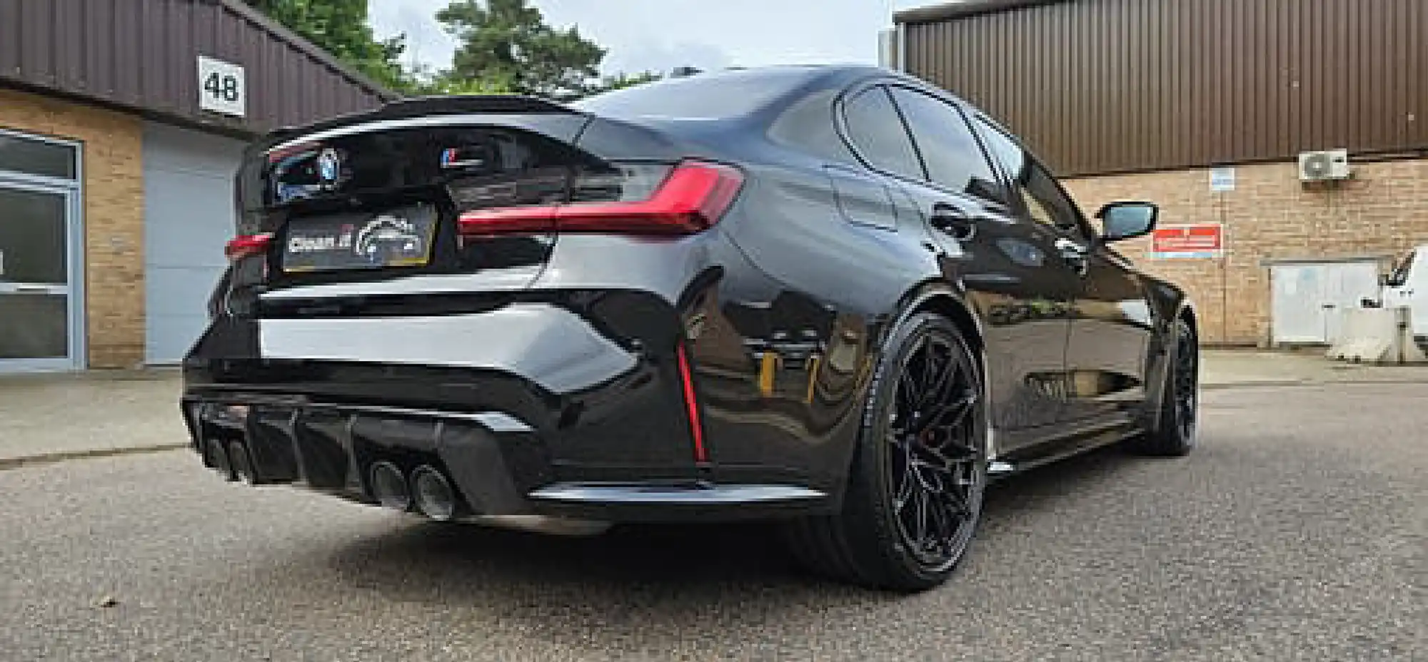 bmw m4 competition package with a wide rear bumper