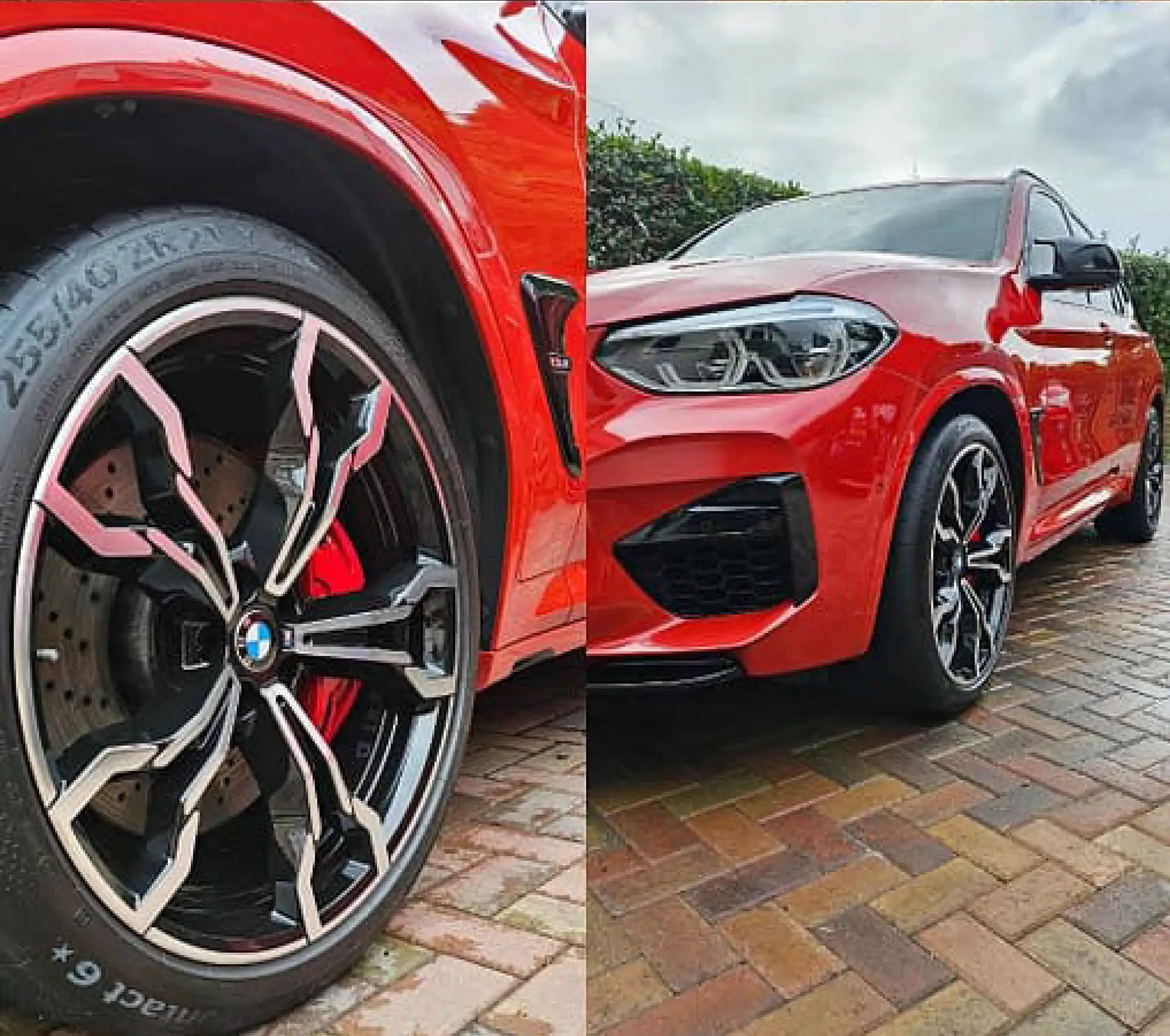 red bmw suv parked on a road