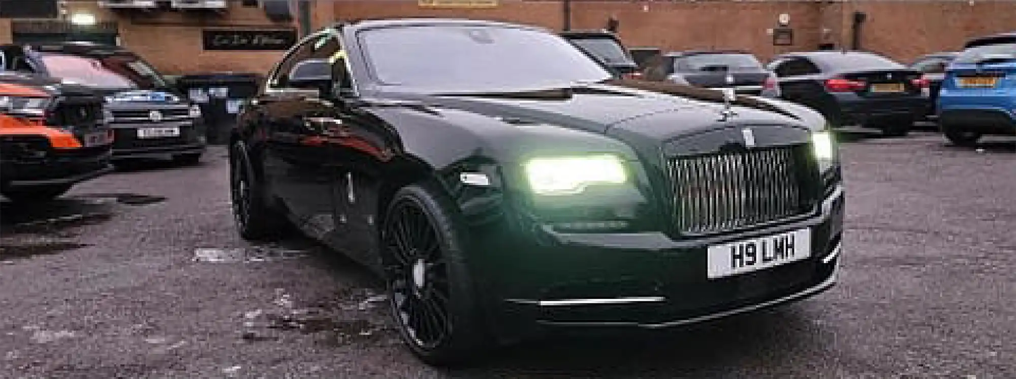 a green car pard in a parking space